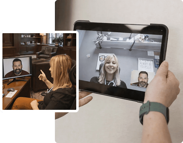 Person holding tablet displaying video call participants